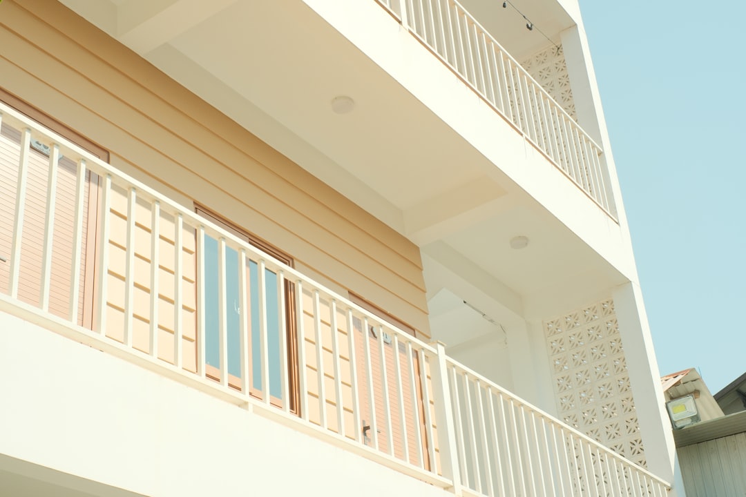 modern-building-exterior-with-balconies-and-wood-paneling-jj6dnil1eda
